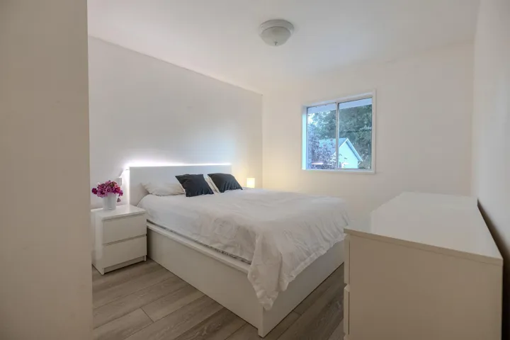 Bedroom with light wood-style floors