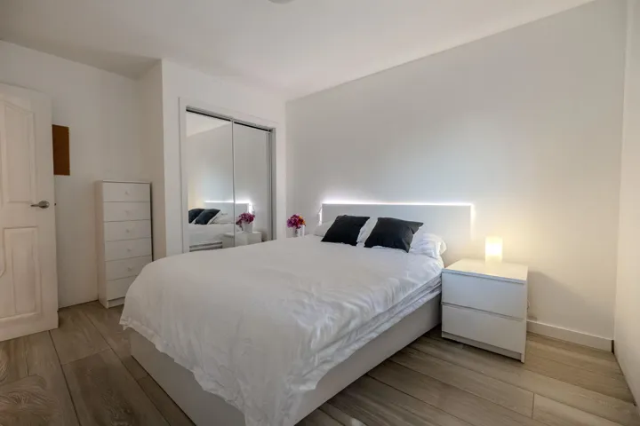 Bedroom featuring light wood-type flooring and a closet