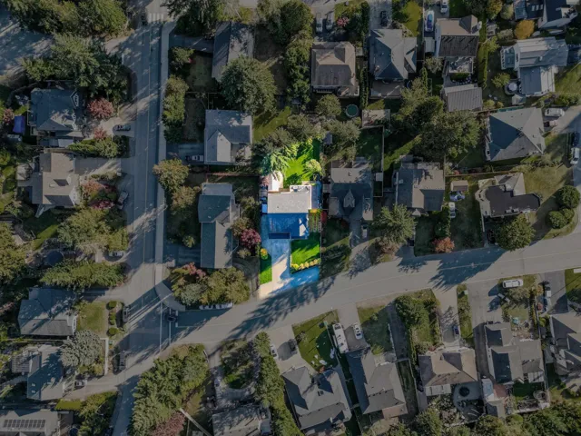 Aerial overview of property's location with nearby suburban area