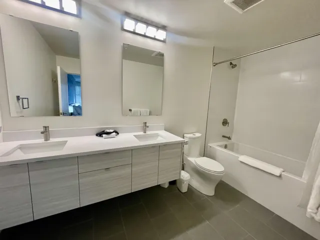 Full bathroom featuring tile patterned floors, visible vents, a sink, and toilet