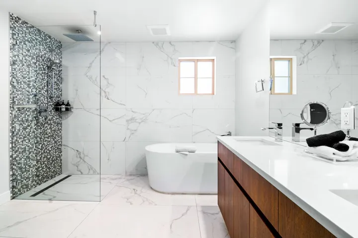 Full bath featuring a sink, a marble finish shower, a soaking tub, and marble finish floor