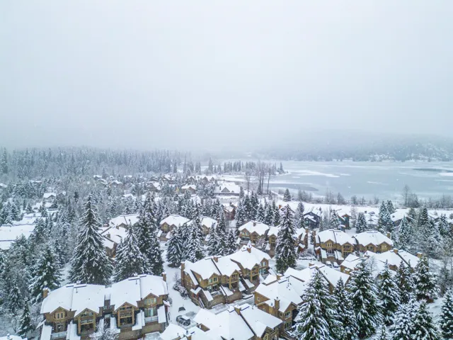 Snowy aerial view with a residential view