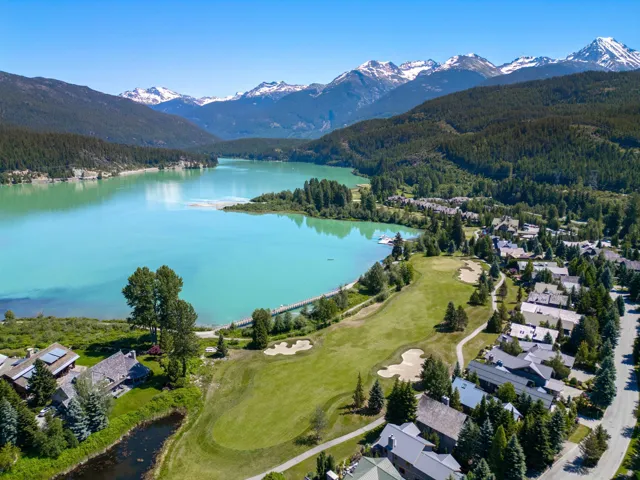 Bird's eye view featuring a forest view and a water and mountain view