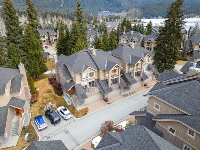 Drone / aerial view with a wooded view and a residential view