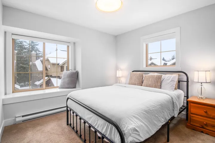Bedroom featuring baseboard heating and carpet flooring