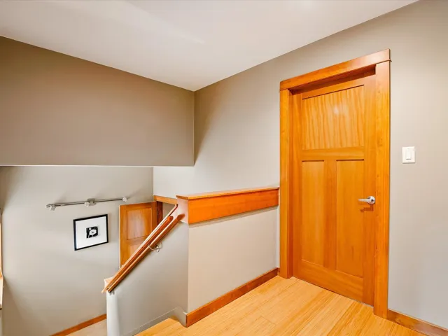 Stairs featuring baseboards and wood finished floors