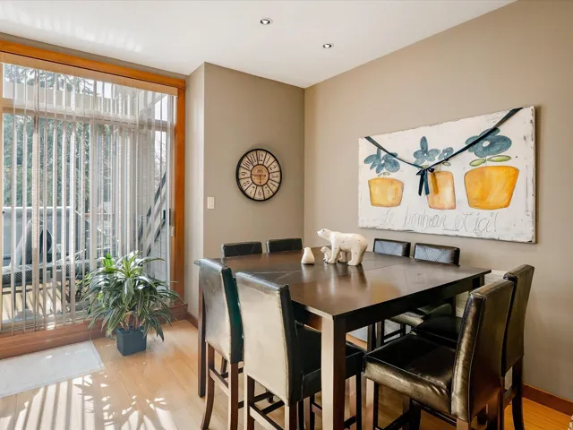 Dining room with baseboards and light wood-type flooring
