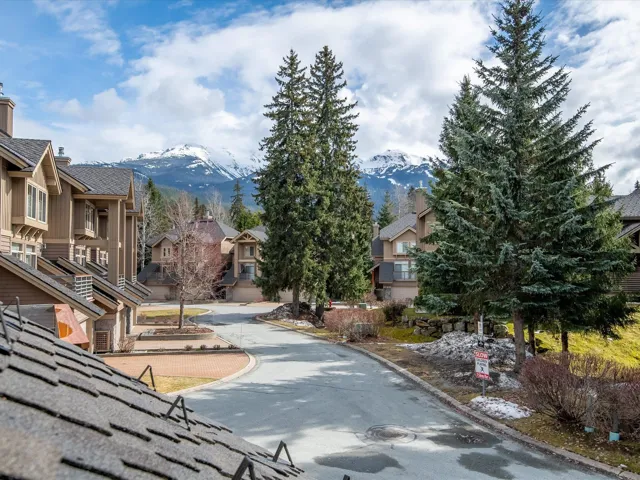 View of road with a mountain view, a residential view, and curbs