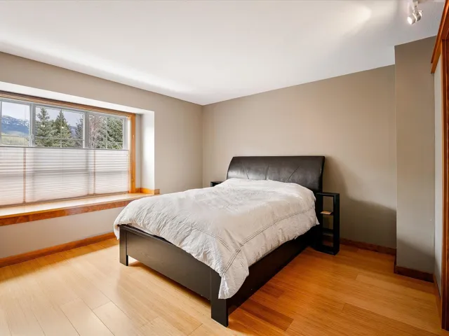 Bedroom with baseboards and light wood-style flooring
