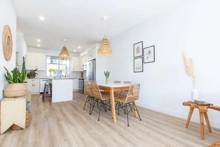Dining room with light wood-style floors, baseboards, and recessed lighting