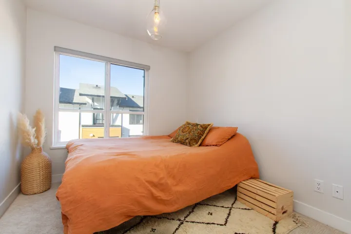 Carpeted bedroom featuring baseboards