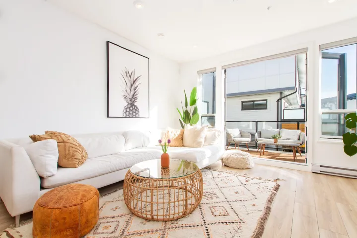 Living room with wood finished floors and baseboard heating