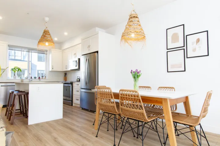 Dining room with light wood-type flooring, baseboards, and recessed lighting