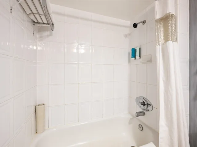 Full bath featuring shower / bath combination with curtain