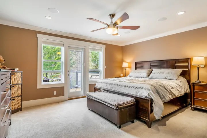 Bedroom with access to exterior, ornamental molding, light carpet, ceiling fan, and recessed lighting