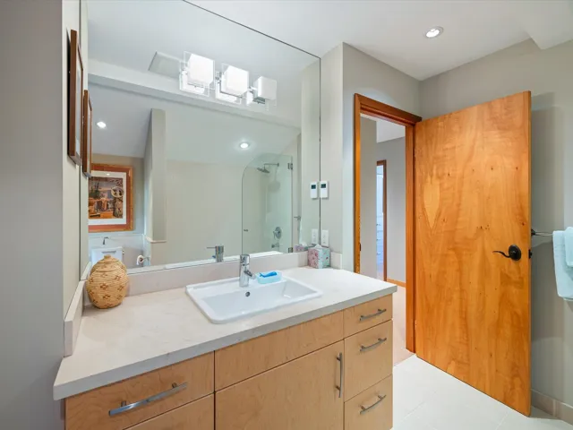 Bathroom with vanity, recessed lighting, and light tile patterned flooring