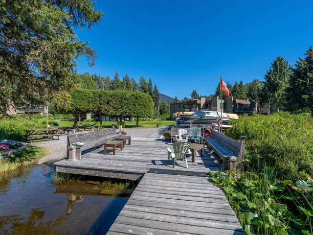 Dock area with a water and mountain view