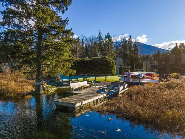 Dock area featuring a water and mountain view