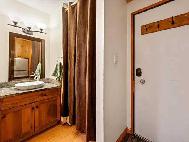 Bathroom featuring light wood finished floors and vanity