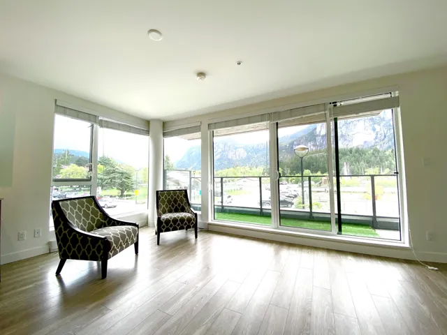 Sunroom / solarium featuring wood finished floors and baseboards