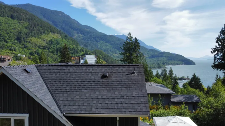 Mountain view with a large body of water and a heavily wooded area