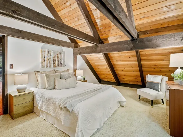 Bedroom with carpet, wood ceiling, and lofted ceiling with beams