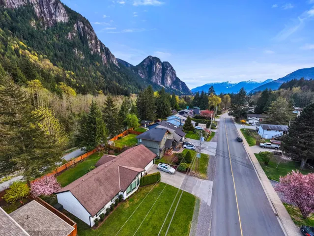 Aerial perspective of suburban area featuring a mountainous background