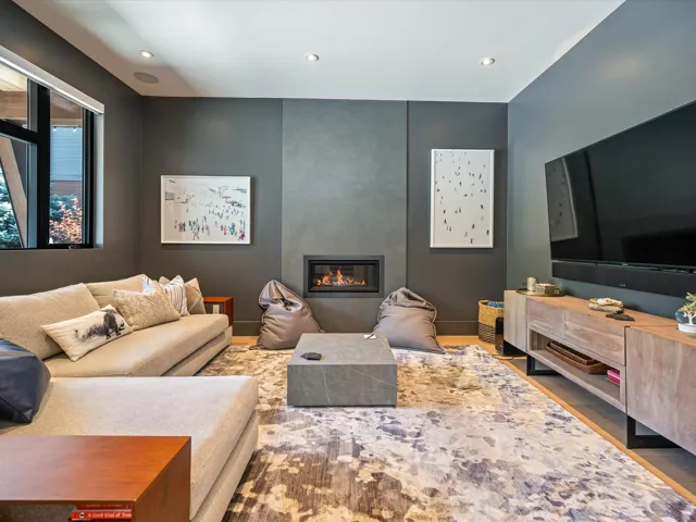 Living area featuring a fireplace, wood finished floors, and recessed lighting