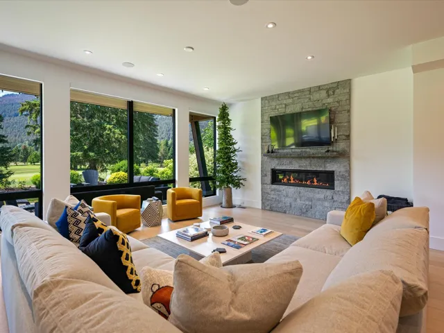 Living area featuring wood finished floors, a fireplace, and recessed lighting