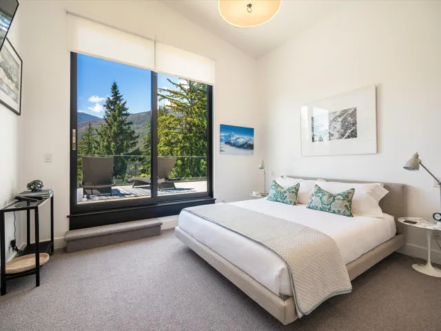 Bedroom featuring carpet flooring and a mountain view