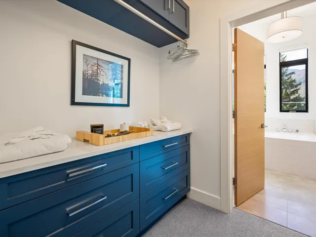 Full bath with vanity, a bath, and light tile patterned floors