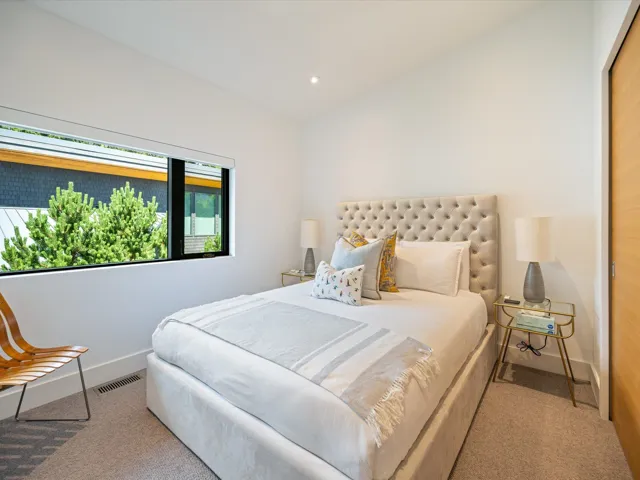 Carpeted bedroom with recessed lighting and baseboards