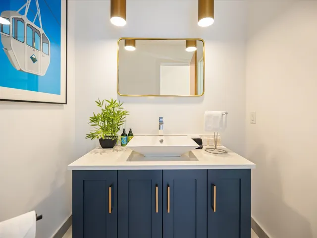 Bathroom with vanity and baseboards
