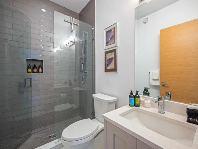 Bathroom with vanity and a stall shower