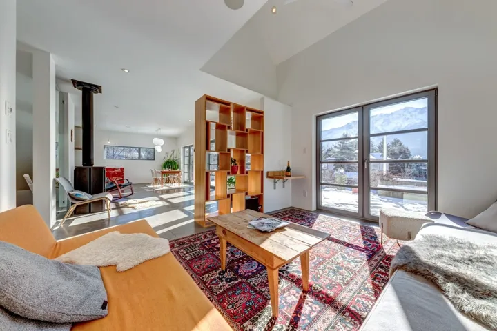 Living room featuring a wood stove and recessed lighting