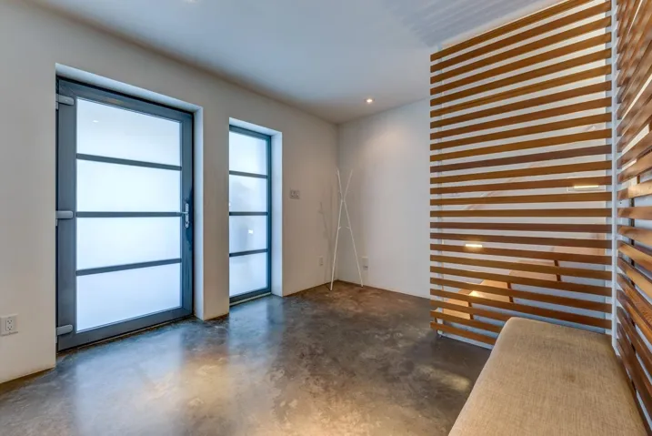 Unfurnished room with concrete floors and recessed lighting