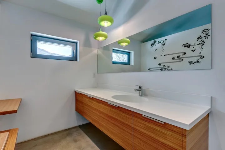 Bathroom with vanity and concrete flooring