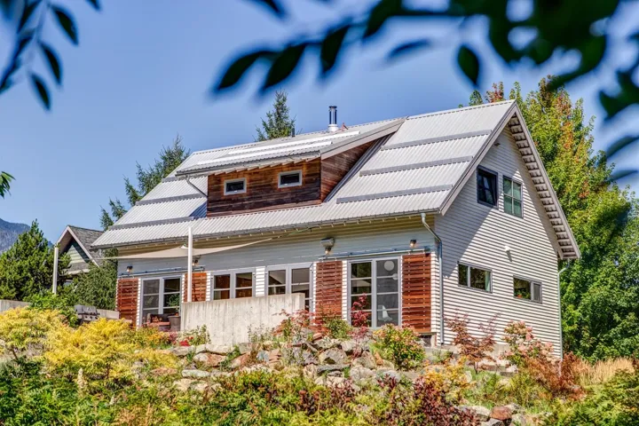 Back of house with a metal roof