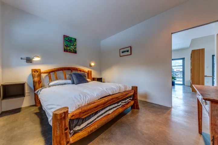 Bedroom with concrete flooring