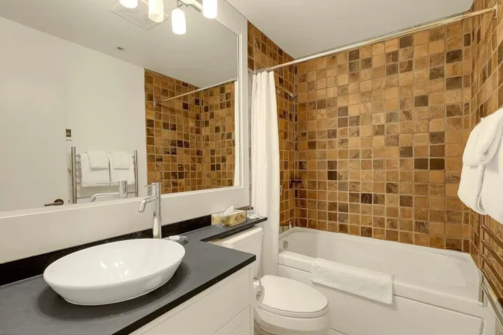 Full bathroom with vanity and shower / bath combination with curtain