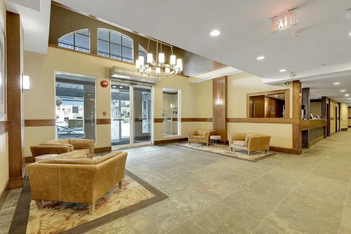 Common area featuring a high ceiling and recessed lighting