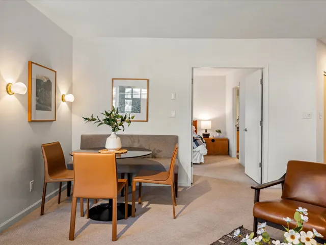Dining area with light carpet
