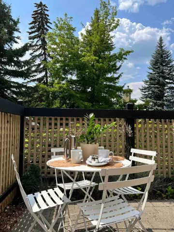 Wooden deck featuring outdoor dining area