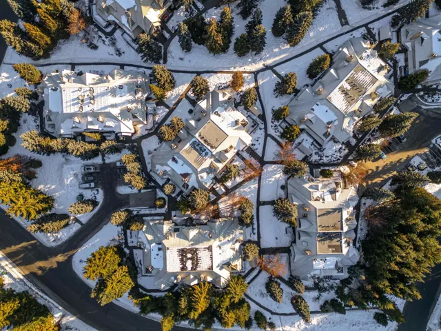 Aerial view of property's location featuring nearby suburban area