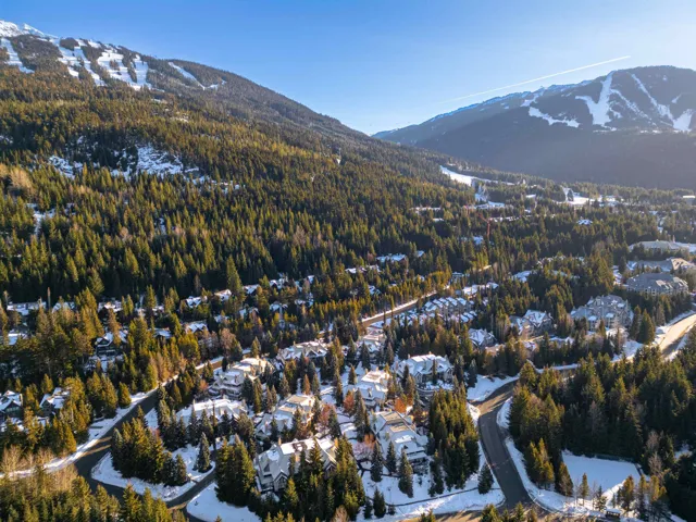 View of property location featuring a mountain backdrop and nearby suburban area