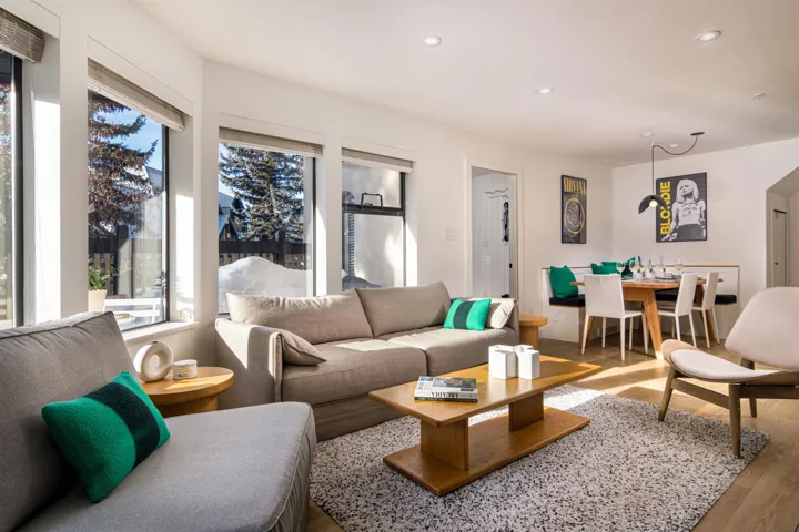 Living room with wood finished floors and recessed lighting