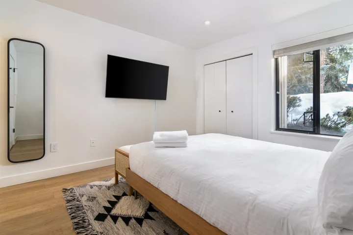 Bedroom featuring light wood-type flooring, recessed lighting, and a closet