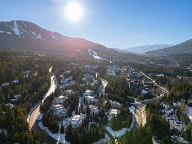 Aerial view of property and surrounding area with mountains