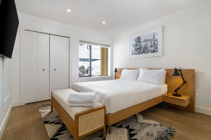 Bedroom featuring wood finished floors, recessed lighting, and a closet