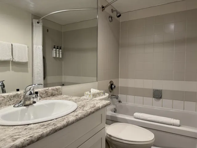 Full bathroom with vanity and shower / tub combo